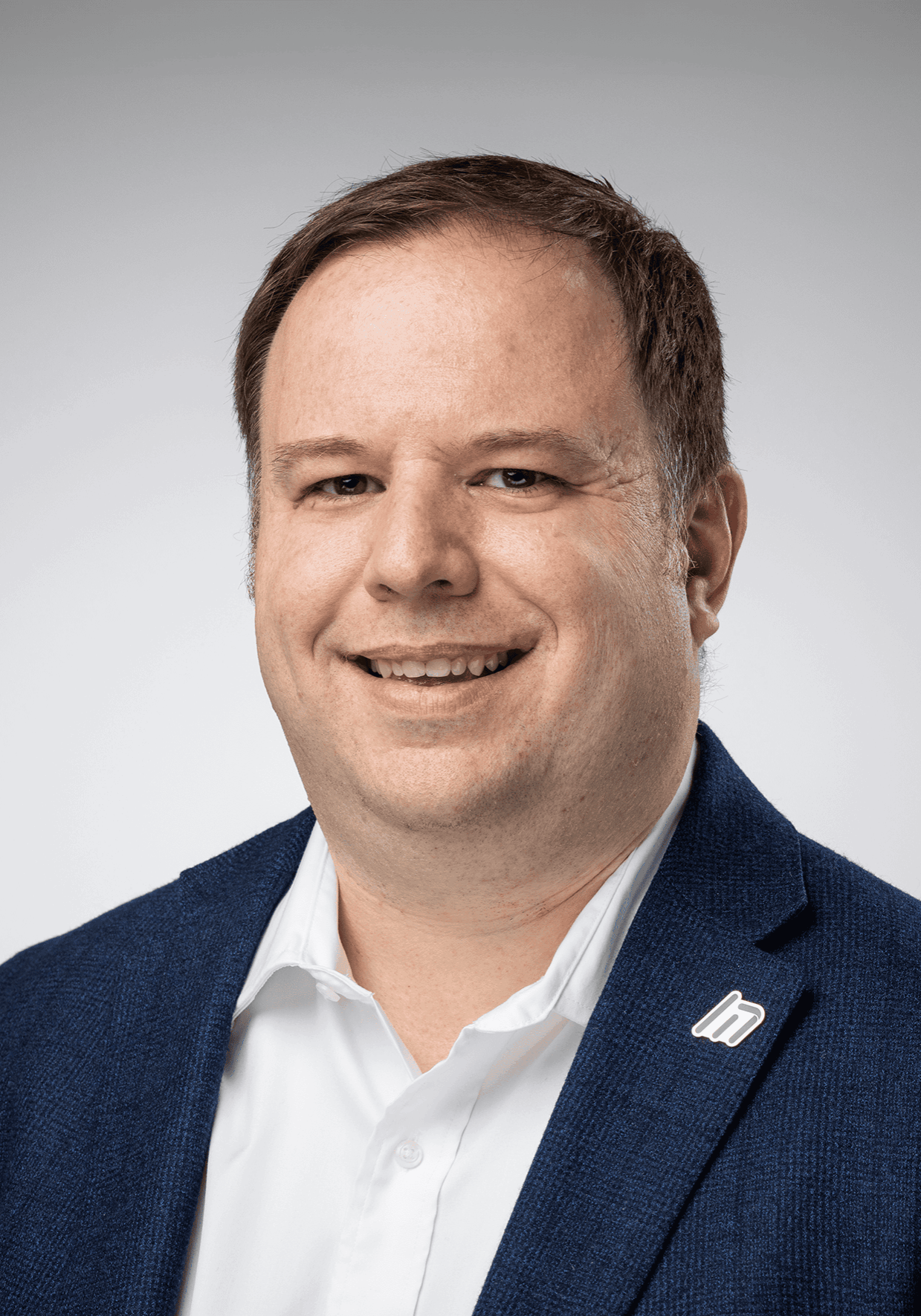 Headshot of Andrew Volkening